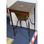 An Edwardian painted topped work table with central cartouche W.40cm