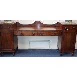 A George IV mahogany pedestal sideboard W.243cm