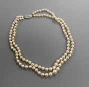 A double strand graduated cultured pearl necklace, with diamond set white metal clasp, 38cm.