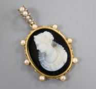 A late 19th century continental yellow metal and split pearl set sardonyx cameo pendant, 58mm