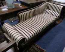 A Regency mahogany chaise longue, ebony line-inlaid and covered in striped brocade, on outswept legs