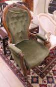 A Victorian walnut spoonback armchair