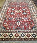 A Kazak red ground carpet 220 320cm