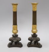 A pair of French Second Empire bronze and ormolu pillar candlesticks, H 29cm H.29.5cm