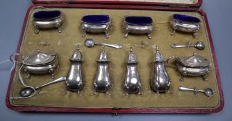 A cased matched early 20th century ten piece silver cruet set.