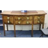 A George III mahogany bow-fronted sideboard with Greek key pattern inlay, fitted four short