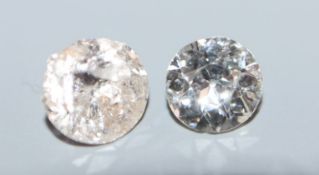 Two unmounted round cut diamonds, approximately 0.41cts and 0.50cts, the latter a.f.