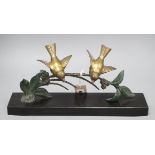 Plagnet, spelter of two birds on a branch, on a black slate base, signed W.40cm Length of base 40cm