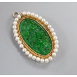 A 14k mounted jadeite and cultured pearl set oval pendant brooch, 5cm.