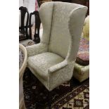 An early 19th century upholstered tub framed armchair