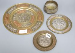 A mixed metalware set of Indian plates and a bowl