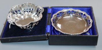 Two pierced silver sweetmeat dishes, one cased.