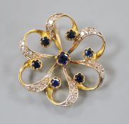 A 750 yellow metal, sapphire and diamond set openwork flower head pendant, 24mm.