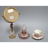 An early Herend cup and saucer overlaid glass scent bottle and a gilt glass mirror