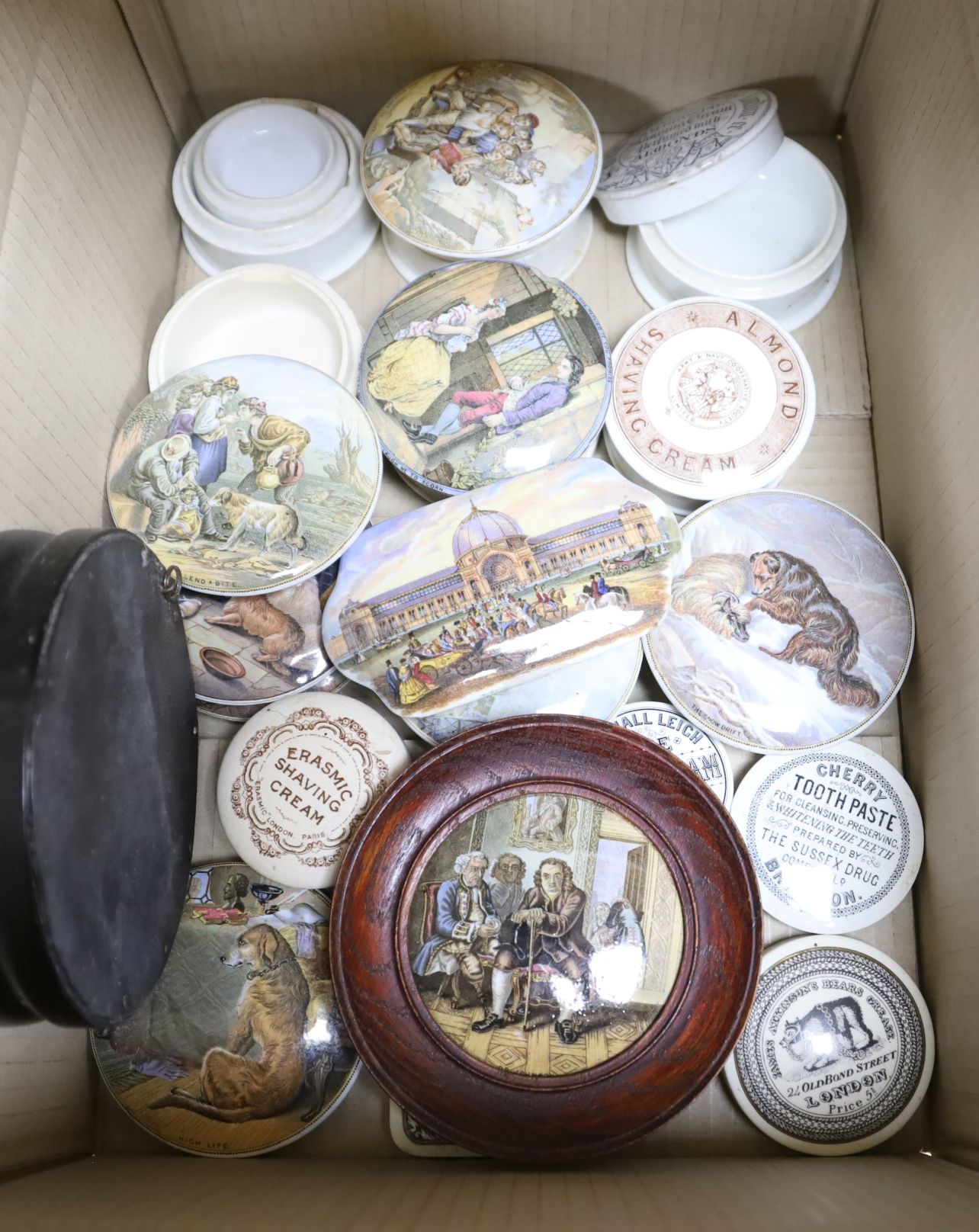 A group of Pratt ware pot lids and boxes