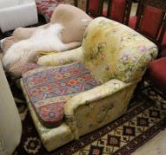 A near pair of Howard style upholstered armchairs