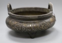 A large Chinese bronze tripod censer, Xuande mark but later, decorated with Kufic script and with