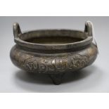 A large Chinese bronze tripod censer, Xuande mark but later, decorated with Kufic script and with