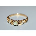 An Edwardian 18ct gold, cat's eye chrysoberyl and diamond set dress ring, size M/N.