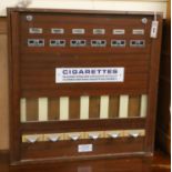 A cigarette vending machine W.67cm