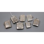 Seven assorted late 19th/early 20th century silver vesta cases, largest 47mm.