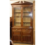A James Shoolbred walnut bookcase / cabinet W.120cm