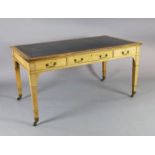 A late Victorian Gillows of Lancaster oak writing table, with gilt black leather skiver and three