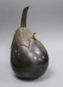 A Japanese Meiji period bronze model of an aubergine, mounted with a preying mantis, signed and with