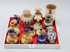 Thirteen Doulton miniature vases and a jug