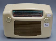 A white bakelite radio height 26cm width 38cm