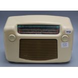 A white bakelite radio height 26cm width 38cm