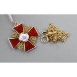 An early 20th century Russian 56 zolotnik yellow metal and enamel cross pendant and an 18ct chain,