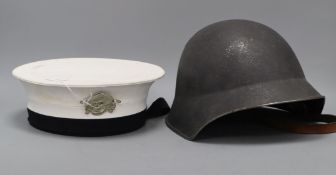 A WWII helmet and a sailor's cap