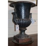 A cast iron urn height 43cm