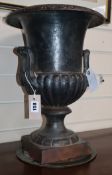 A cast iron urn height 43cm