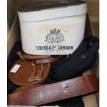 A boxed top hat, sporran, belt and jacket