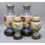 A pair of Chinese cloisonne enamel vases and covers and a pair of similar vases, wood stands tallest
