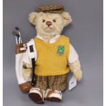 A Steiff golfer bear, boxed with bag 32cm