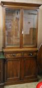 A Victorian mahogany bookcase cupboard W.96cm