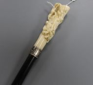 A 19th century German ebonised walking cane with carved ivory handle L.92cm