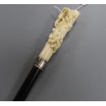A 19th century German ebonised walking cane with carved ivory handle L.92cm