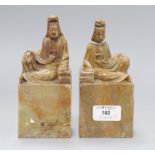 A pair of Chinese soapstone chops with seated figures height 16cm