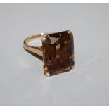 A 1960's 9ct gold and emerald cut citrine set dress ring, size O.