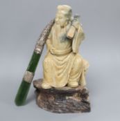 A 19th century hardstone carved sage on stand and a jade letter opener