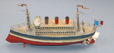 A rare early 1900s tinplate three funnelled clockwork powered ocean liner probably by Fleischmann