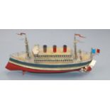 A rare early 1900s tinplate three funnelled clockwork powered ocean liner probably by Fleischmann