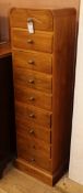 A contemporary narrow chest of drawers H.130cm