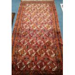 A Bokhara red ground carpet 260 x125cm