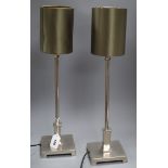 A pair of brushed steel table lamps height 53cm