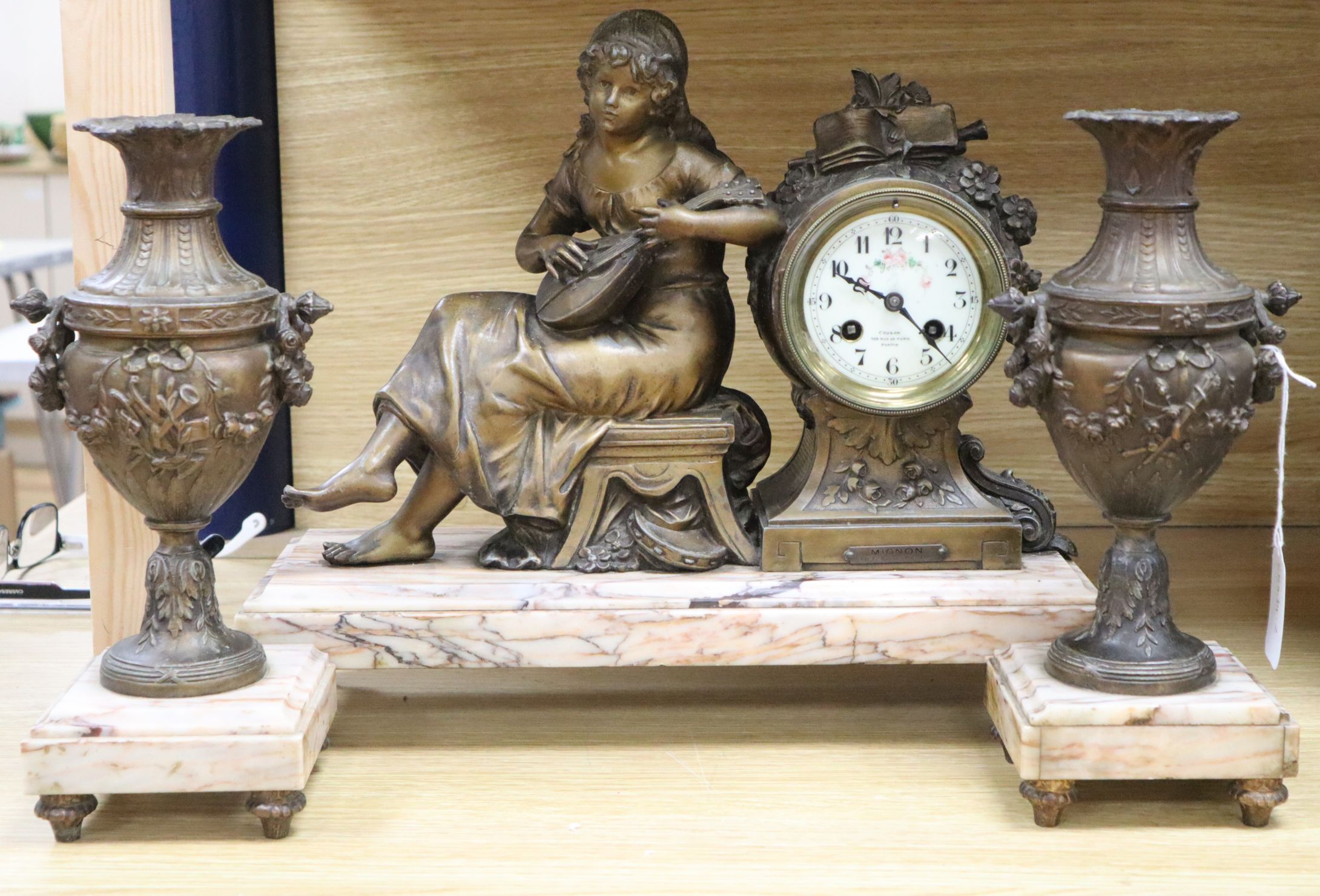 A French spelter figural clock garniture, signed Francois Moreau